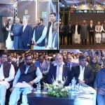 Officials and consortium representatives at Lake City Meadows Phase 1 Extension handover ceremony, including Chairman NAB Lt. Gen. (R) Nazir Ahmed Butt, project developers, and plot owners, marking the formal commencement of possession for residential plots.