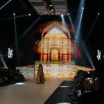 LAAM Fashion Week Season 2 Day 2 runway show in Lahore featuring a model in traditional attire against an illuminated architectural backdrop celebrating Pakistani fashion and heritage.